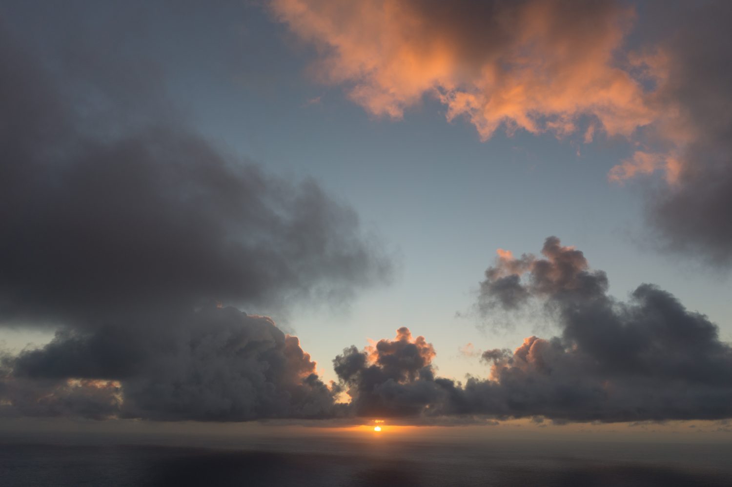 Sunrise peeking through clouds